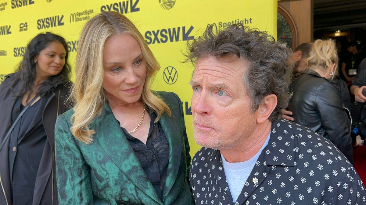 Michael J. Fox and Tracy Pollan on the SXSW carpet in front of the festival step-and-repeat.